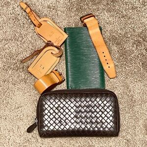 Vintage Louis Vuitton and Bottega Veneta wallets and luggage tags.